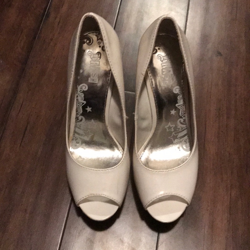 White platform open toe heels.